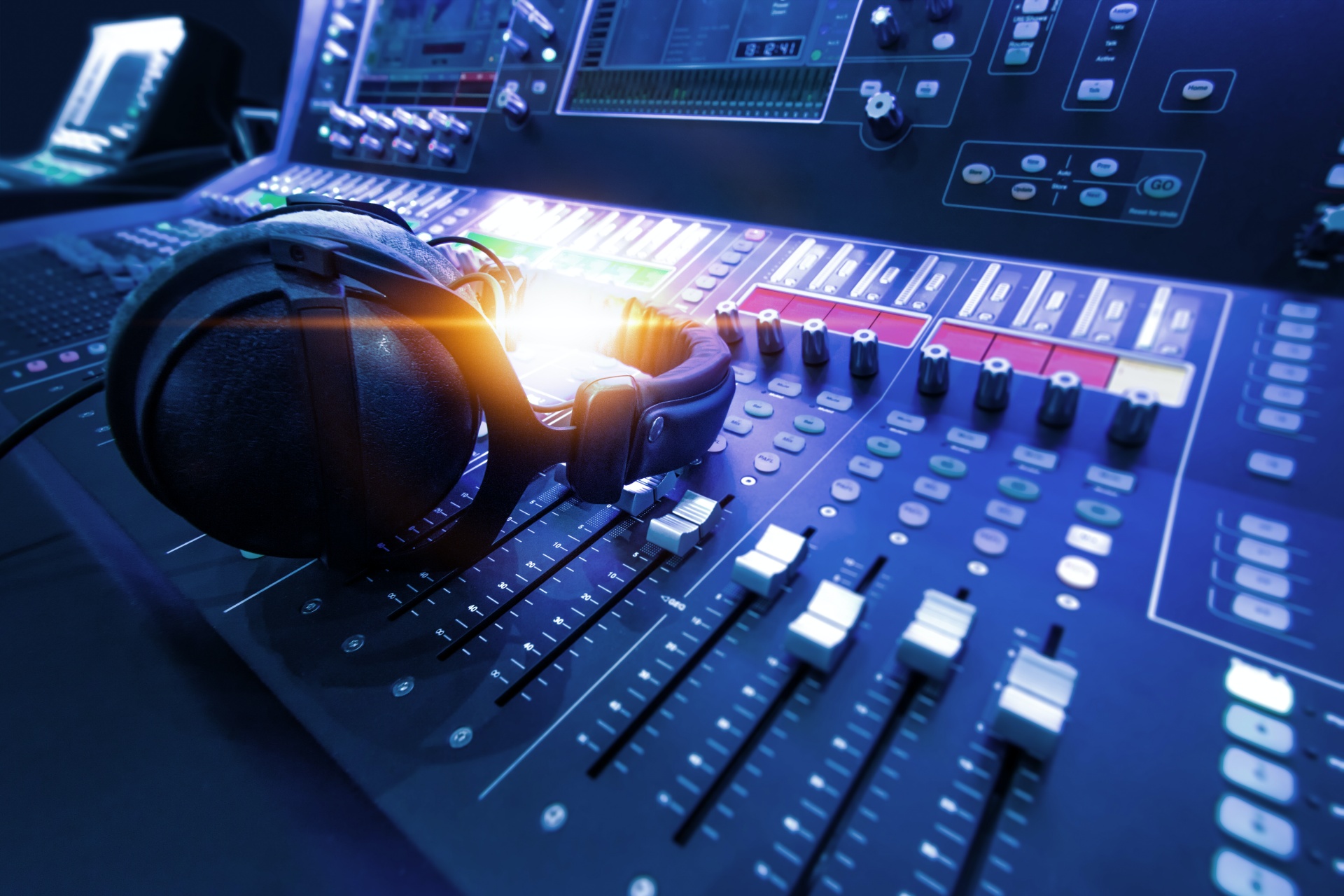 radio station soundboard with headphones on it radio station soundboard with headphones on it
