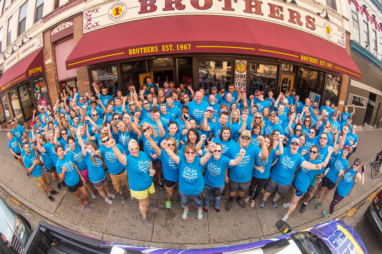 Group event photo in front of a building