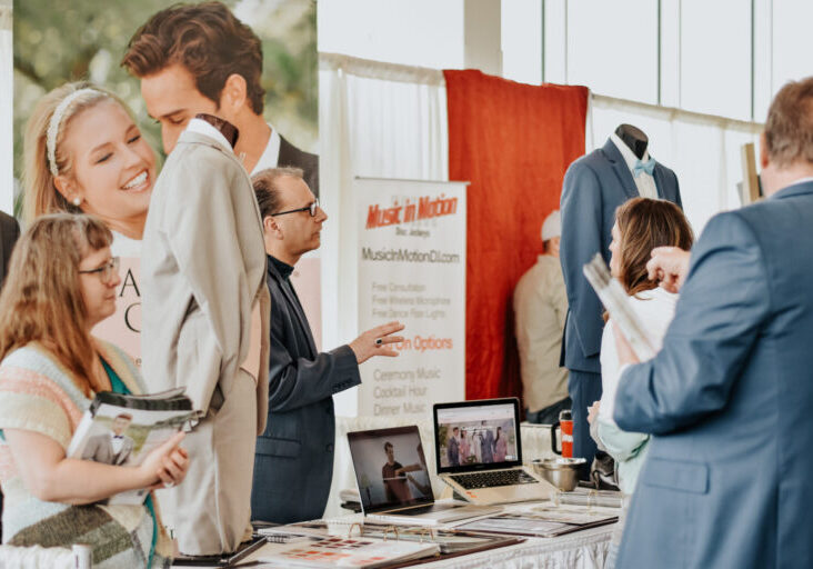 People at a trade show booth.